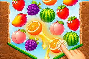 Frutas coloridas alineadas en un tablero, con una mano tocando naranjas junto a sandías, uvas, fresas y mangos